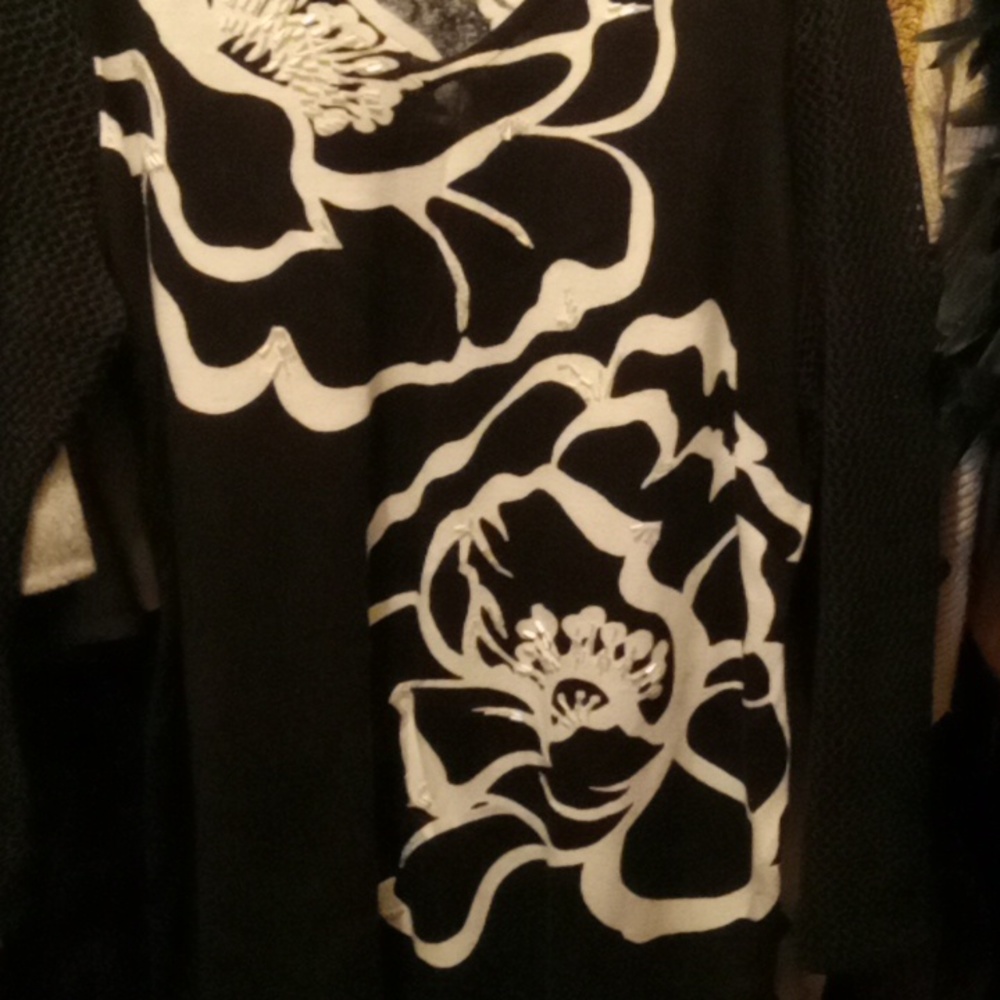 A sweater W Fishnet Sleaves.
